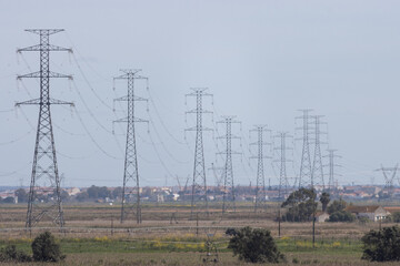 Electric towers in a field near the village