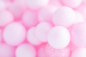 Colorful balls background in pink colors. Background with balls in different sizes. Sphere of balls on pastel color..