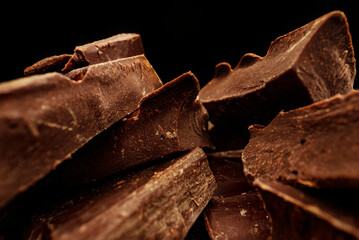 Broken dark chocolate bars. Macro lens.