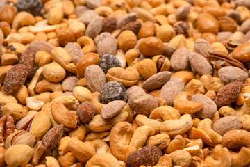 A group of almonds, pistachios, walnuts, macadamia, cashews.