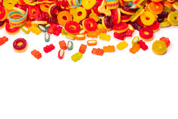 Assorted colorful gummy candies. Top view. Jelly donuts. Jelly bears. Isolated on a white background.