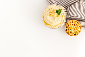 Dishes of chickpeas with tahini - homemade hummus in bowl