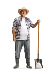 Full length portrait of a happy mature farmer with a shovel
