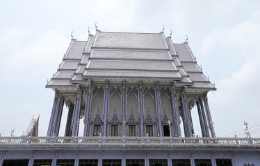 Blue church, is completely covered in blue and white ceramic tiles at Wat Pak Nam Khaem Nu, Chathaburi, Thailand.