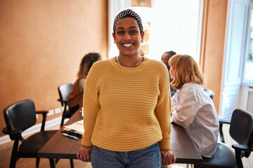 Young businesswoman smiling in a boardroom