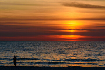 Fototapeta na wymiar Spectacular bright golden sunset over Baltic sea