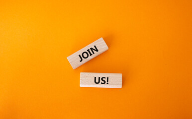 Join us symbol. Concept word Join us on wooden blocks. Beautiful orange background. Business and Join us concept. Copy space