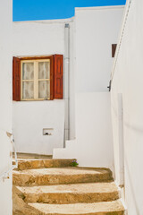 Greek street in a shopping center in Lindos, Rhodes island, Greek islands of the Dodecanese archipelago, Europe. Holidays and travel around the islands, vertical frame