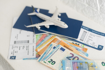 Fototapeta na wymiar Preparing for the trip. Purchase of plane tickets. Documents money aviation