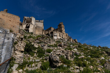 Craco, Basilicata. Abandoned city. A ghost town built on a hill and abandoned due to geological problems. Surreal look, horror film scenery. Panorama of the Calanchi Park.