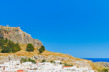 View of the Acropolis and the city of Lindos, Rhodes is famous for its historical sights and...