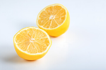 Fototapeta na wymiar Lemon fruit cut in half, isolated on white background. Lemon cut in half isolated on white background.
