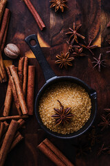 Christmas baking ingredients of gingerbread. Cinnamon, anise and brown sugar
