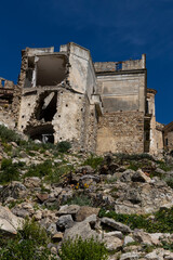 Craco, Basilicata. Abandoned city. A ghost town built on a hill and abandoned due to geological problems. Surreal look, horror film scenery. Panorama of the Calanchi Park.