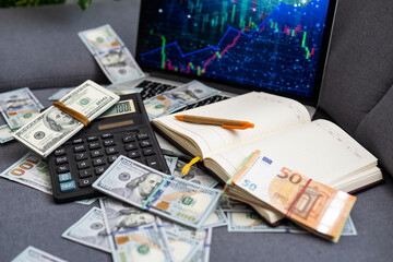 Stock Market Chart on Screen with Dollars and Euros on Background