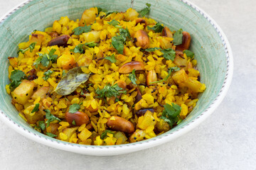Kanda poha or Batata Poha - Indian breakfast meal made of flattened rice.