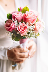 Obraz na płótnie Canvas A bouquet of flowers from a bride on her wedding day