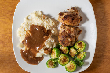 chiocken thighs  with roasted  brussel sprouts and  mashed potatoes