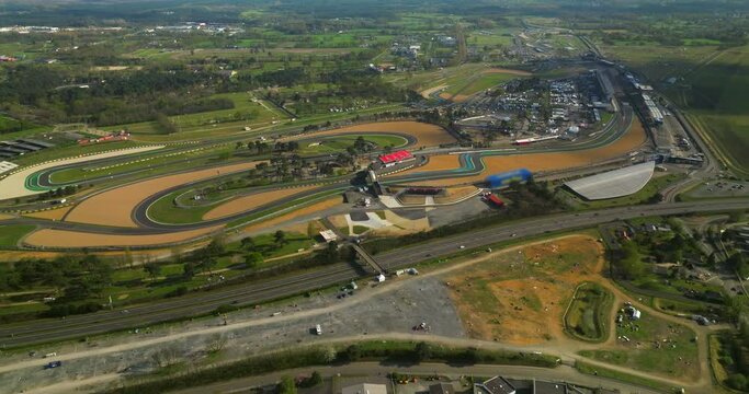 An aerial view of the race track hosting the 24 Hour Endurance Car Race at Le Mans. The famous winding track in Europe. Car racing in France
