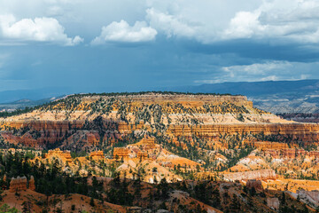Bryce Canyon and table mountain with storm clouds, Bryce Canyon national park, Utah, USA.