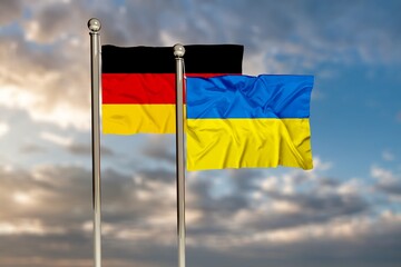 ukraine and flag of germany on beautiful blue sky background