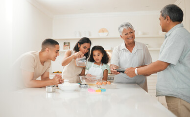 A family that bakes together stays together. three generations of a family baking together.