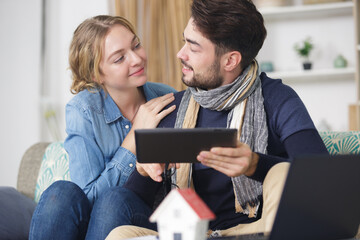 young couple calculating about they savings