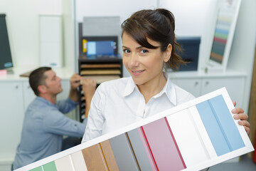 client holding sample of wooden materials