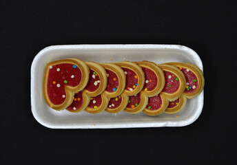 Red heart cookies in a package. Sweet cookies with a heart.