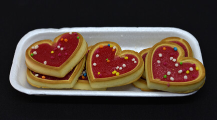 Red heart cookies in a package. Sweet cookies with a heart.