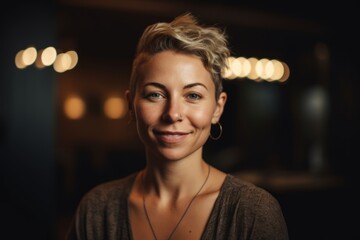 Portrait of a beautiful young woman with short hair in a cafe