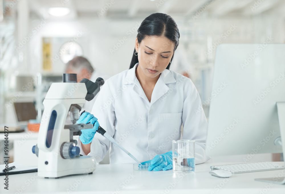 Poster setting up for a new clinical trial. a young scientist working with samples in a lab.