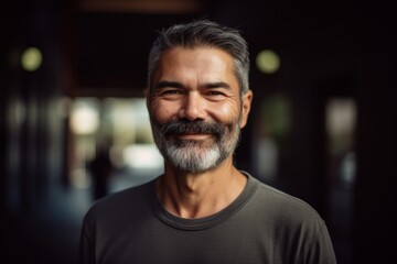 Obraz premium Portrait of a happy mature man smiling at the camera in the city