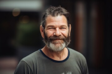Obraz premium Portrait of a handsome mature man with beard in the city.