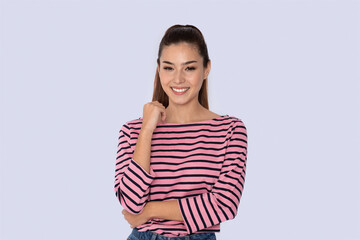 Obraz premium Cheerful young hispanic lady posing on grey studio background