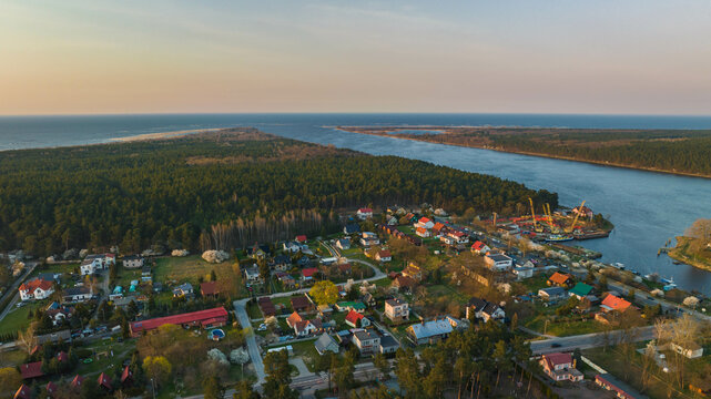 Świbno, Sobieszewo Island. Drone view of the green district of Gdańsk located on the Vistula River. Early spring.