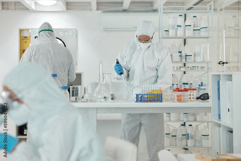 Aufkleber Conducting experiments under defined conditions. a scientist wearing a radiation suit while working with samples in a lab.