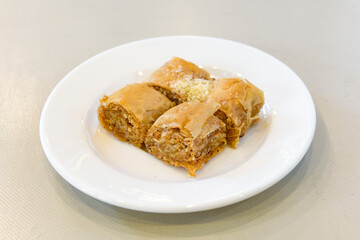 Turkish Dessert Sobiyet Baklava, mussels baklava and classic baklava with Pistachio . Didye, Cevizli, Fistikli Baklava, top view.