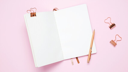 Creative flat lay mockup design of workspace. Top view composition with white notebook, to do list and stationery on pink background