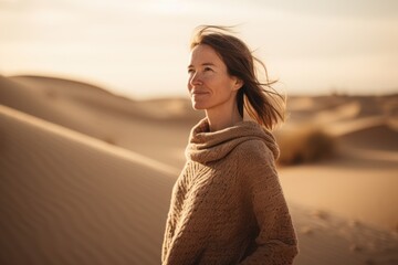 Portrait of a beautiful woman in the middle of the desert.