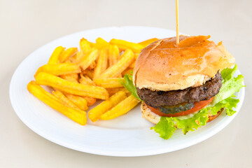 Big tasty burger with beef cutlet on a plate