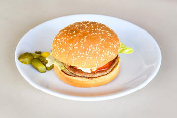 Big tasty burger with beef cutlet on a plate