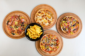Delicious mixed pizza with rich content. Menu concept of choice and diversity. Pepperoni, Formaggi, Veggie, Karisik pizza
