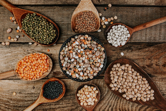 Assortment of colorful legumes on wooden spons
