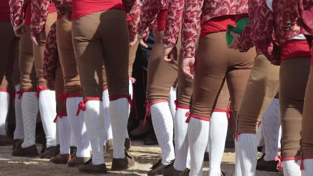 Tourada - Forcados in beige pants walking on the arena in a row