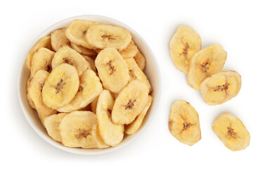 Dried banana chips in ceramic bowl isolated on white background with full depth of field. Top view. Flat lay