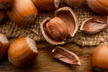 Heap crack hazel nut on sack on wooden table