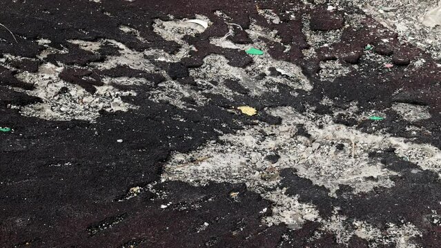 War in Ukraine. Funnel from the explosion in the asphalt. The trace left by the explosion of an artillery shell. Consequences of the rocket attack. Attack of Iranian drones.