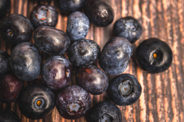 Scattered Blueberries on Wooden Background