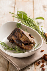 roasted pigeon with dried grape and rosemary
